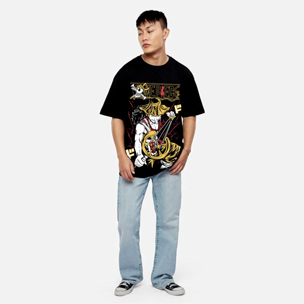 Person wearing a black graphic t-shirt and light blue jean.