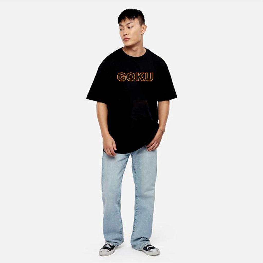 Person wearing a black t-shirt with 'GOKU' printed on it against a white background