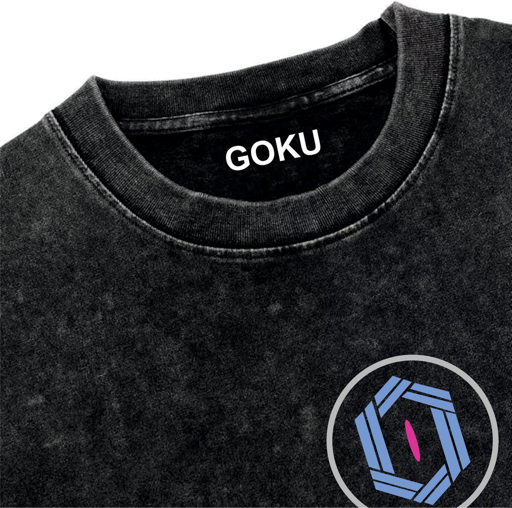Black t-shirt with 'GOKU' text on neckline and blue and pink logo on sleeve.