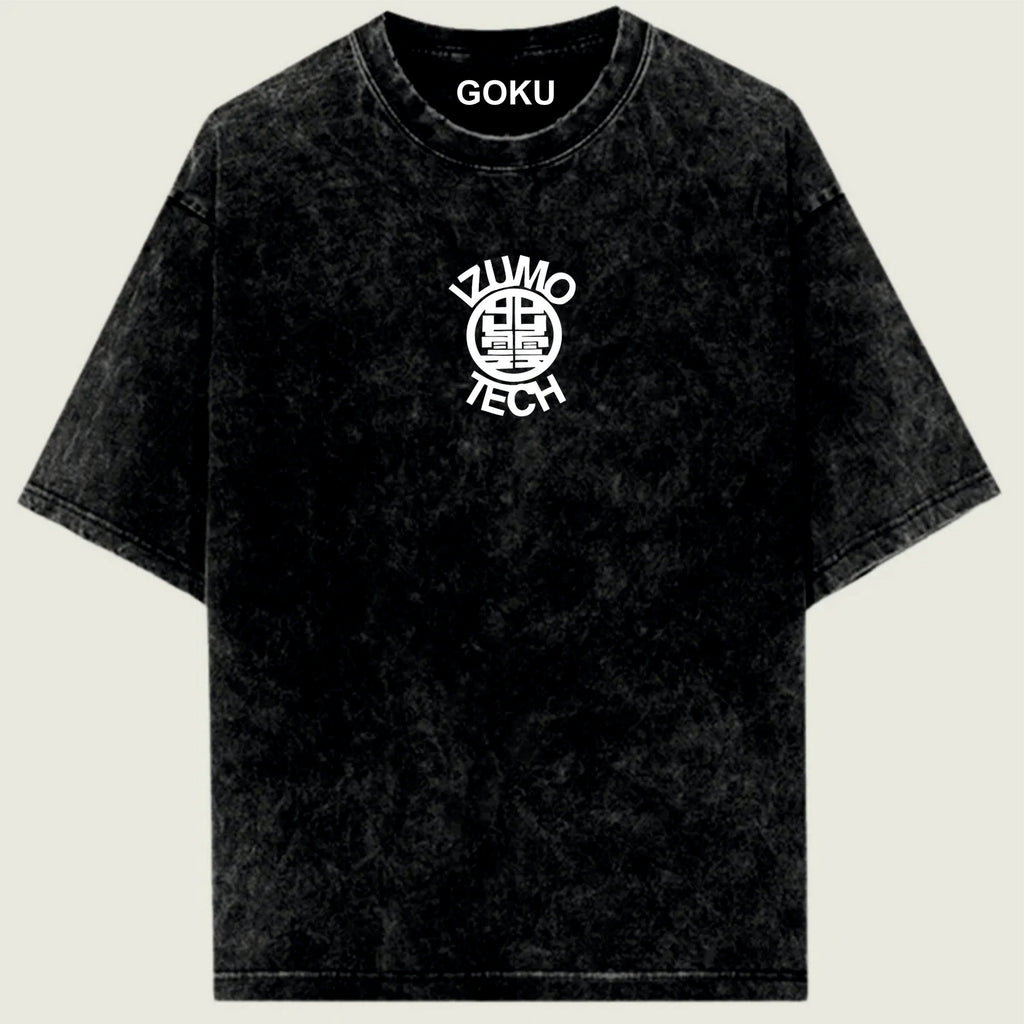 Black t-shirt with 'Goku' and 'Zumo Tech' logos on a light green background