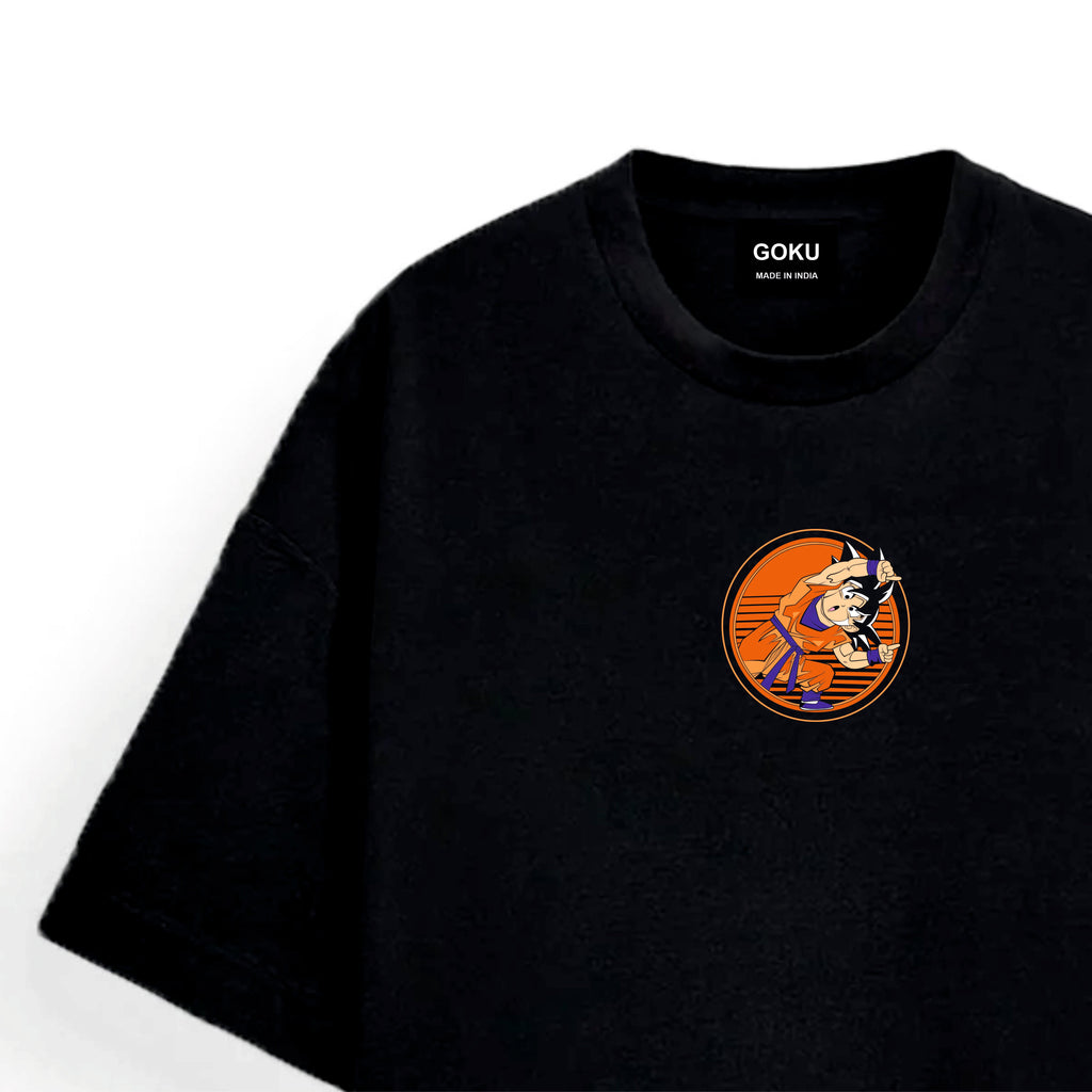 Black t-shirt with a small graphic on the chest against a white background