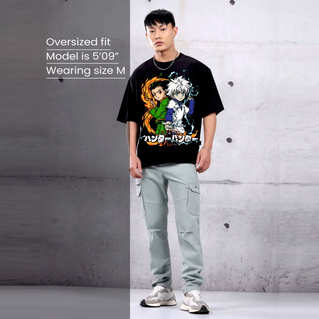 Person wearing a black t-shirt with colorful graphics hunter x