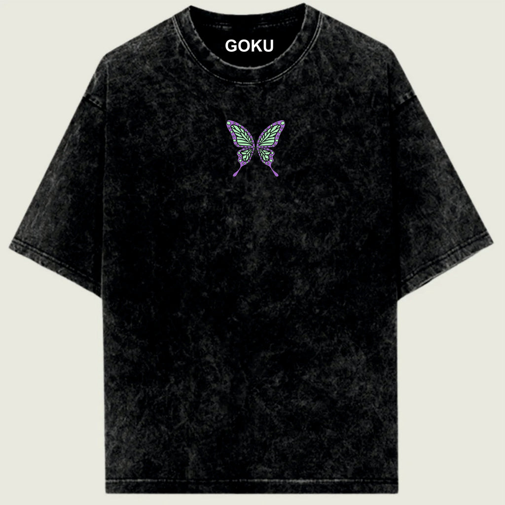 Black t-shirt with a butterfly design and 'GOKU' text on a light green background