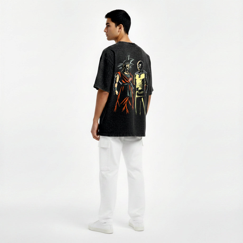Person wearing a black t-shirt with graphic designs on a white background