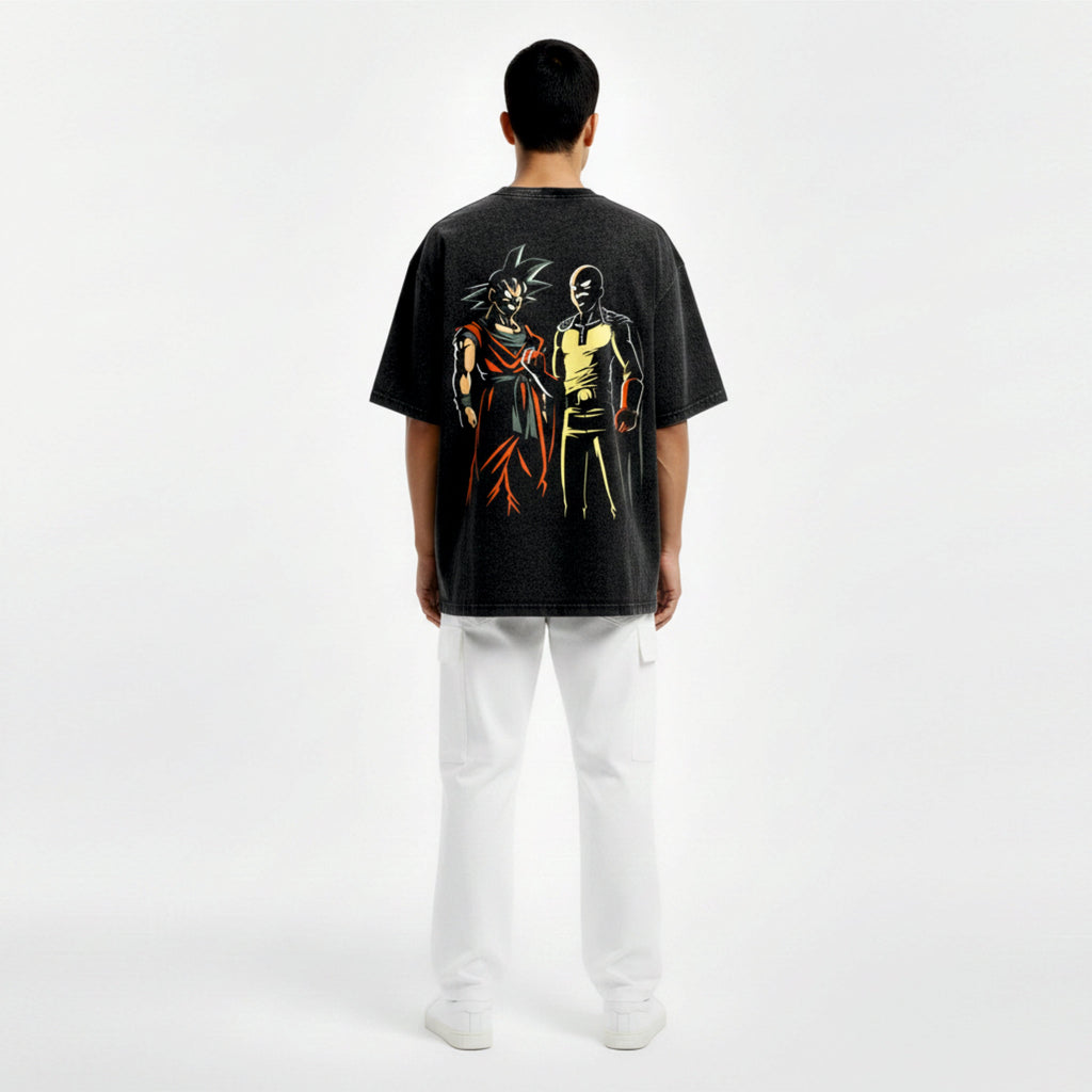 Person wearing a black t-shirt with colorful graphic design on the back, standing against a white background