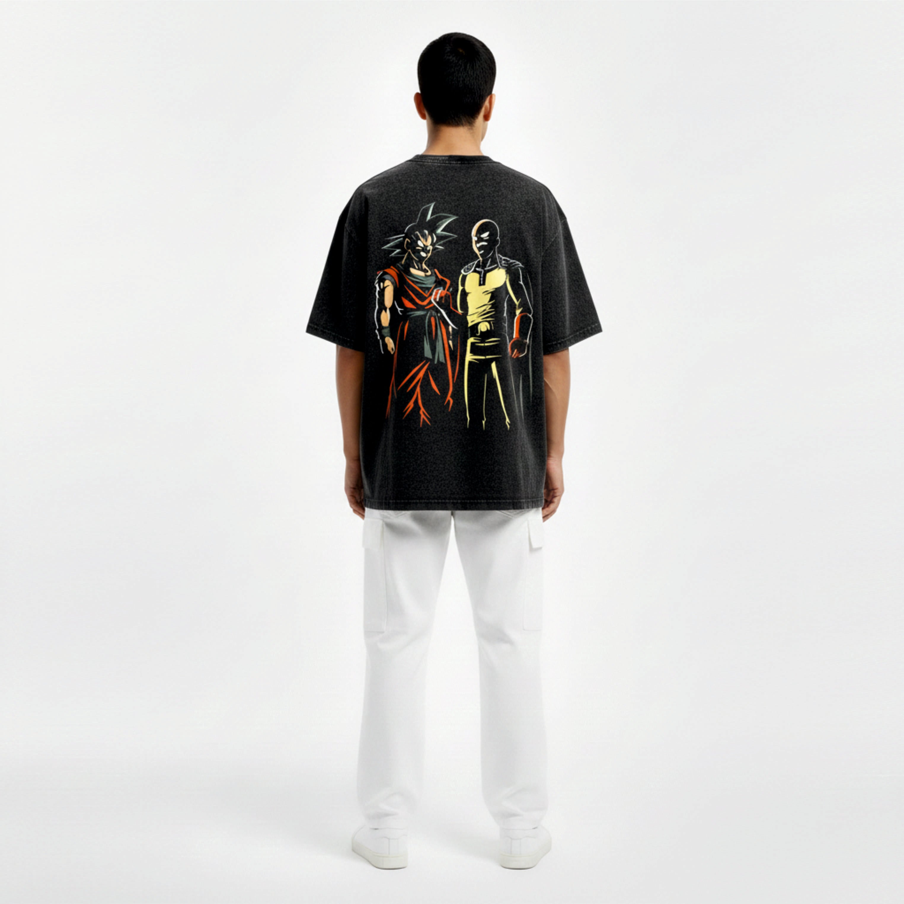 Person wearing a black t-shirt with colorful graphic design on the back, standing against a white background