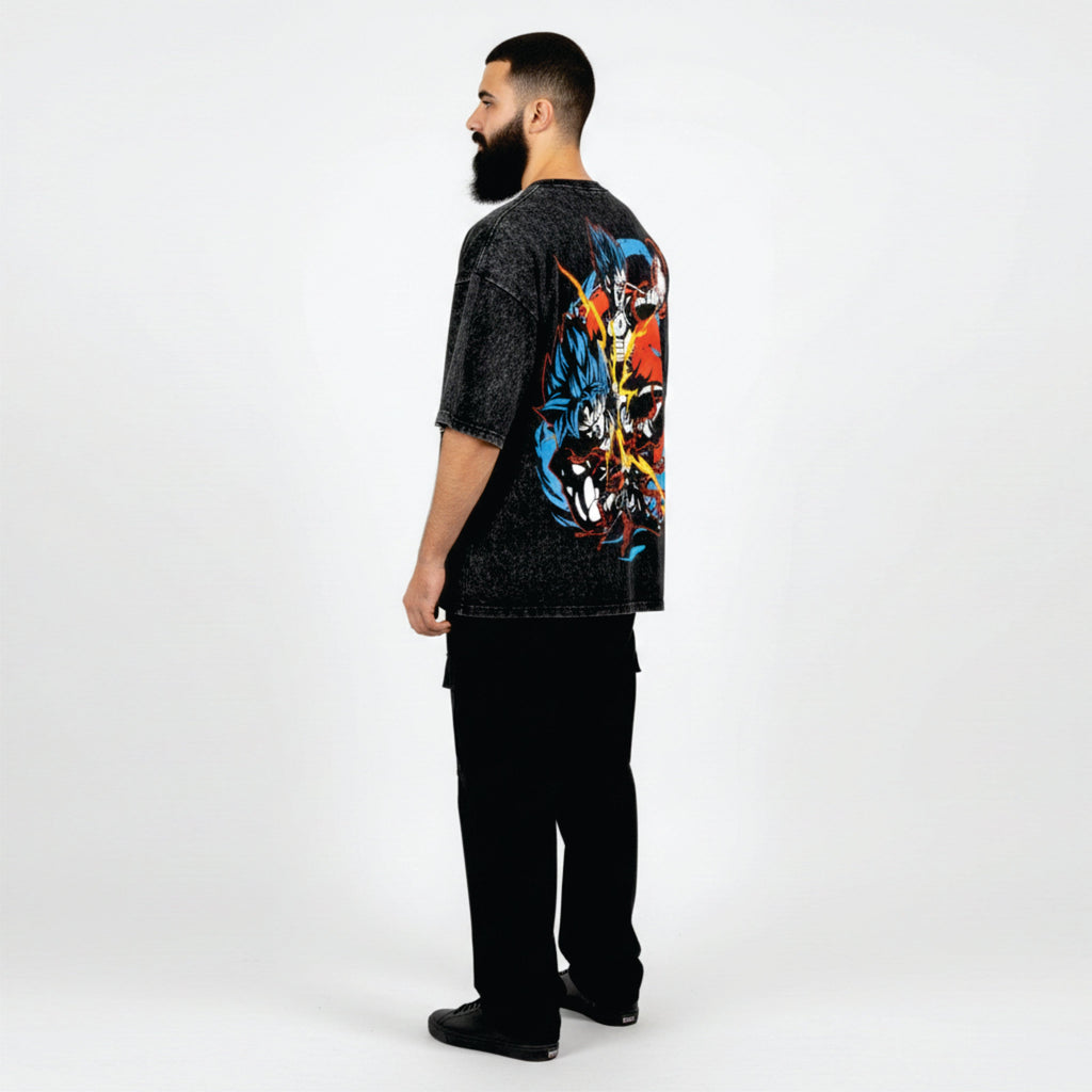 Man wearing a black t-shirt with colorful graphic design on the back, standing against a white background