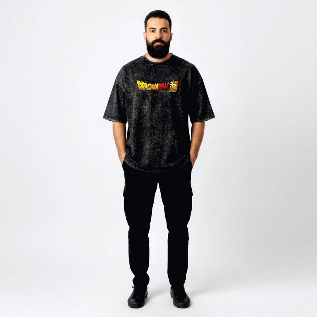 Man wearing a black t-shirt with a colorful graphic on a white background