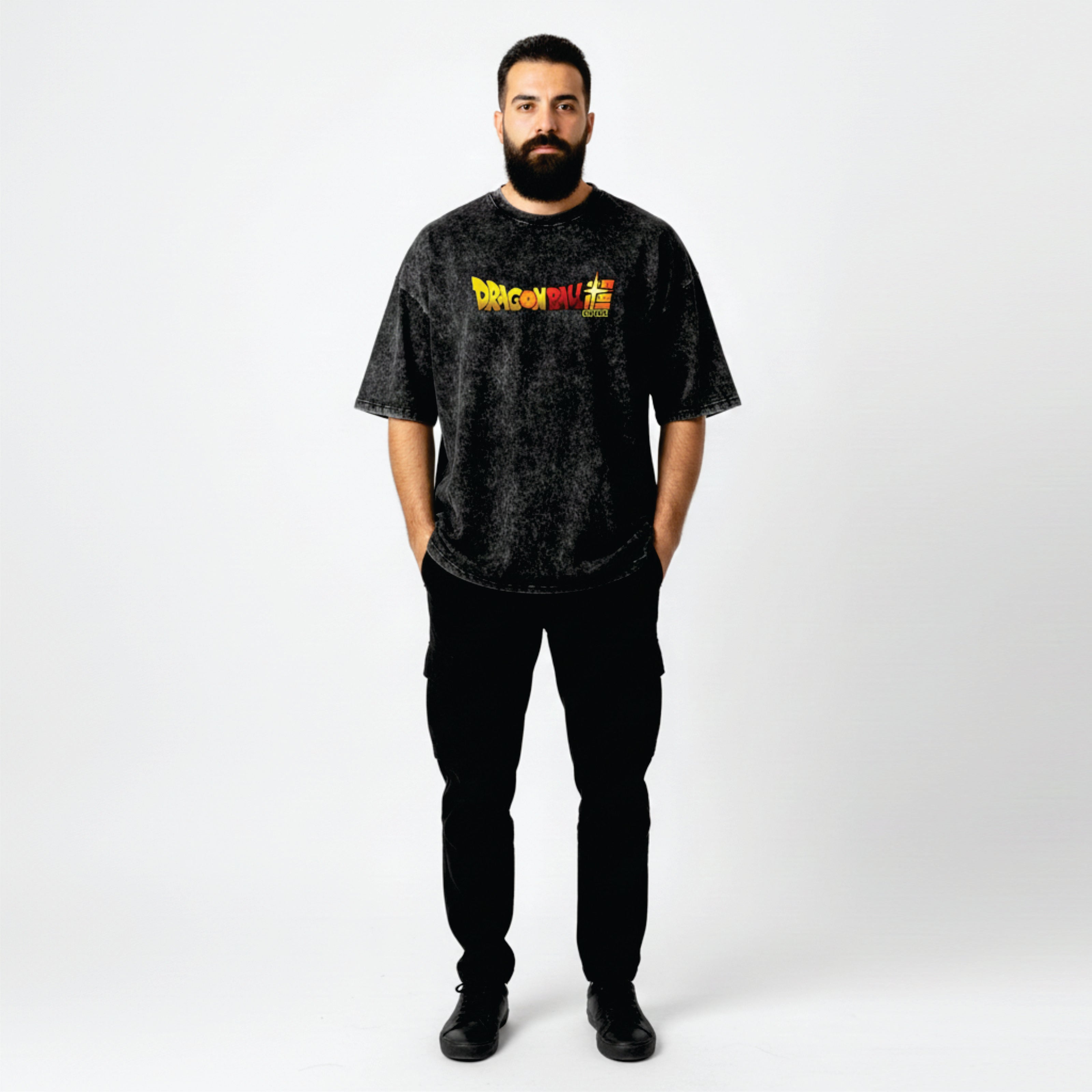 Man wearing a black t-shirt with a colorful graphic on a white background