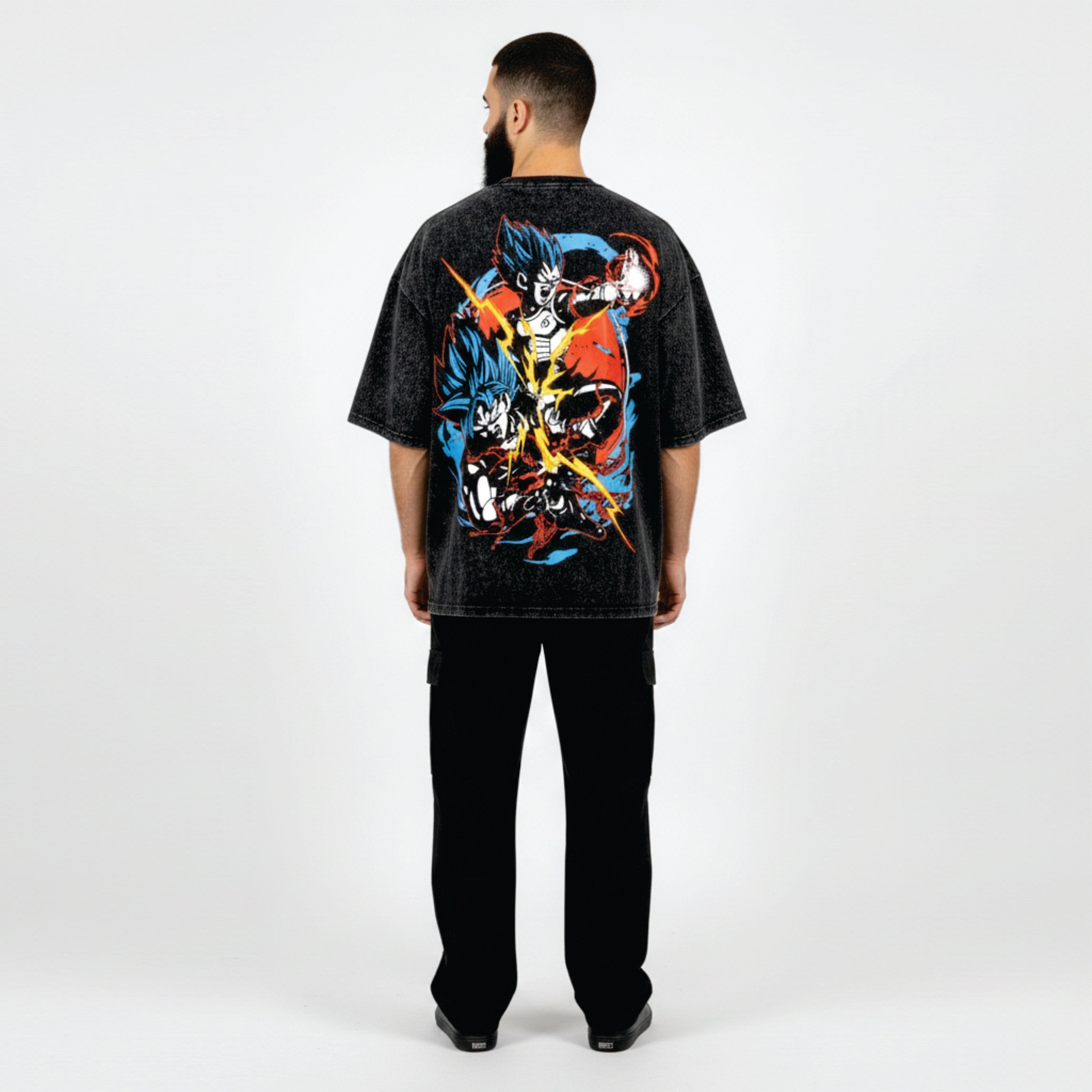 Person wearing a black t-shirt with colorful graphic design on the back against a white background