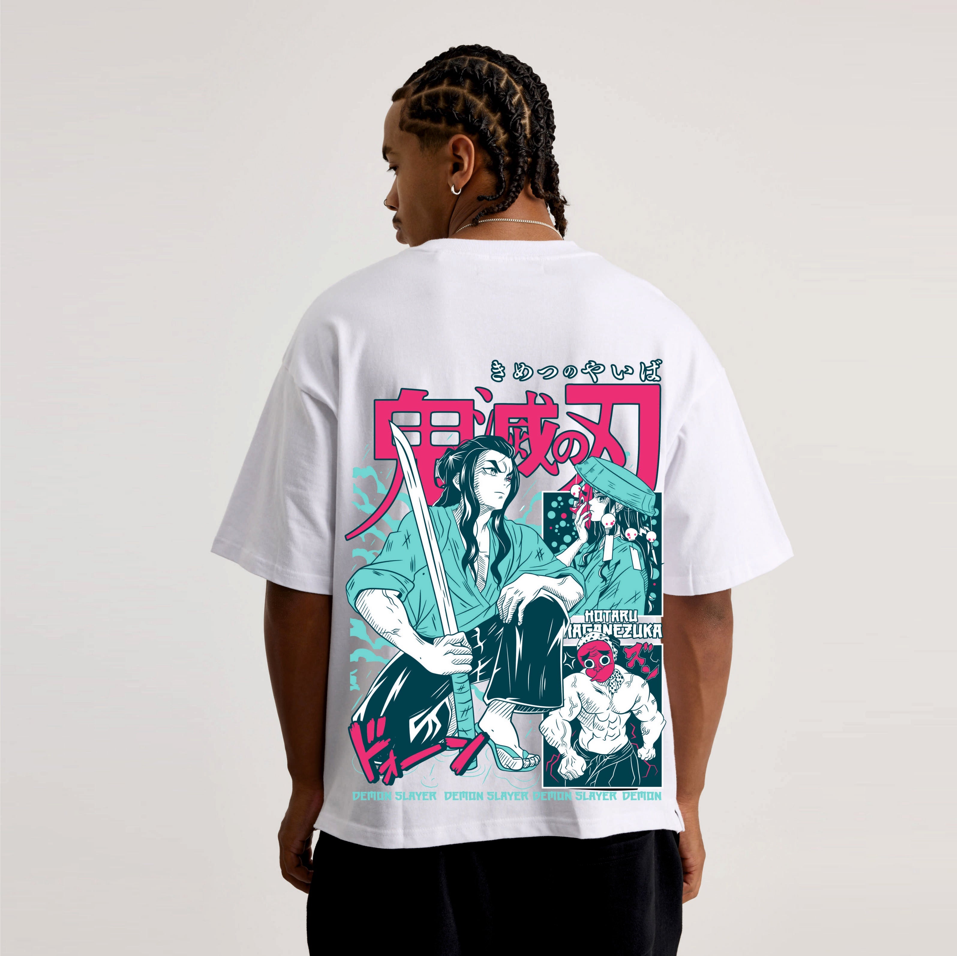 Person wearing a white t-shirt with a colorful graphic Demon slayer design on the back.
