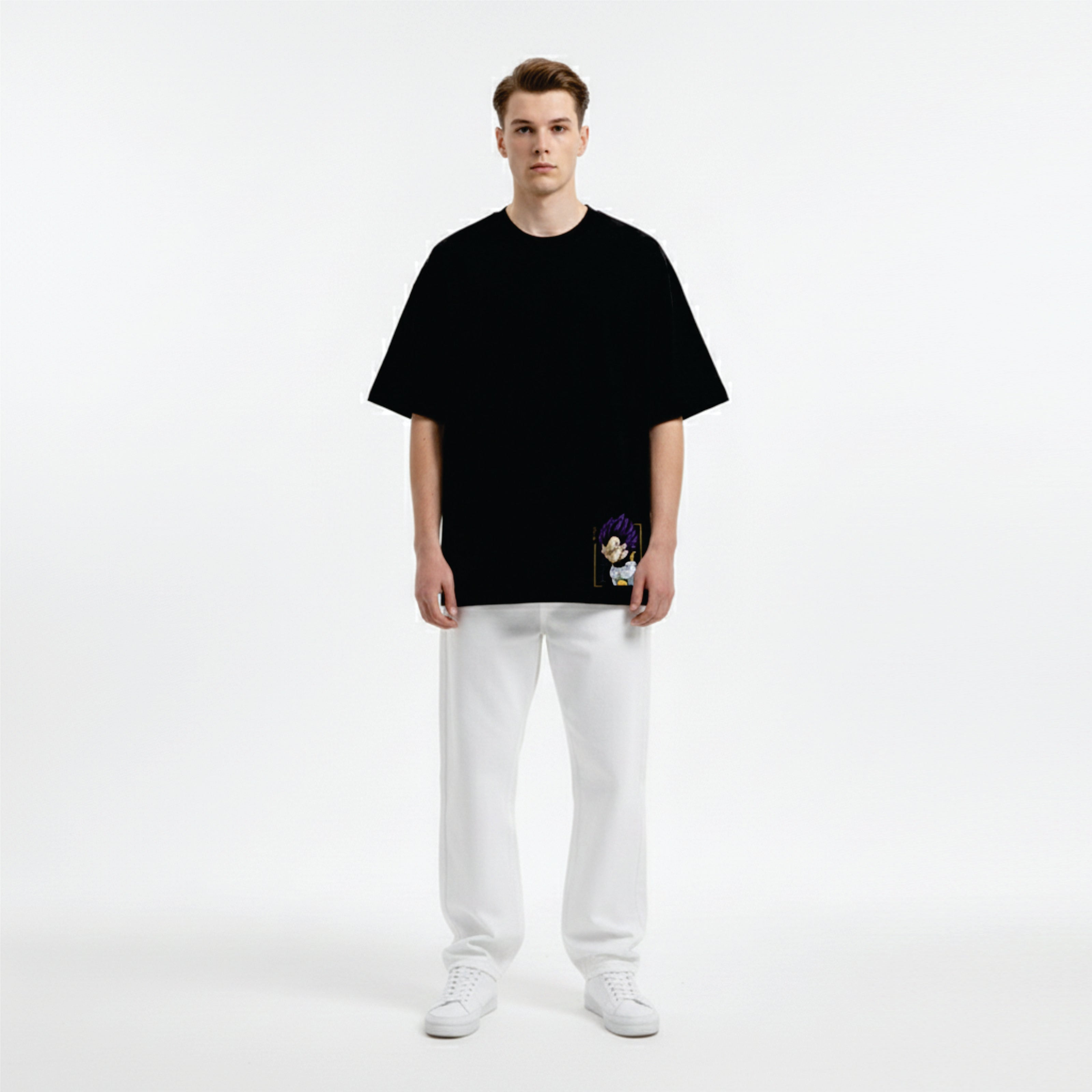 Person wearing a black oversized t-shirt and white pants on a white background