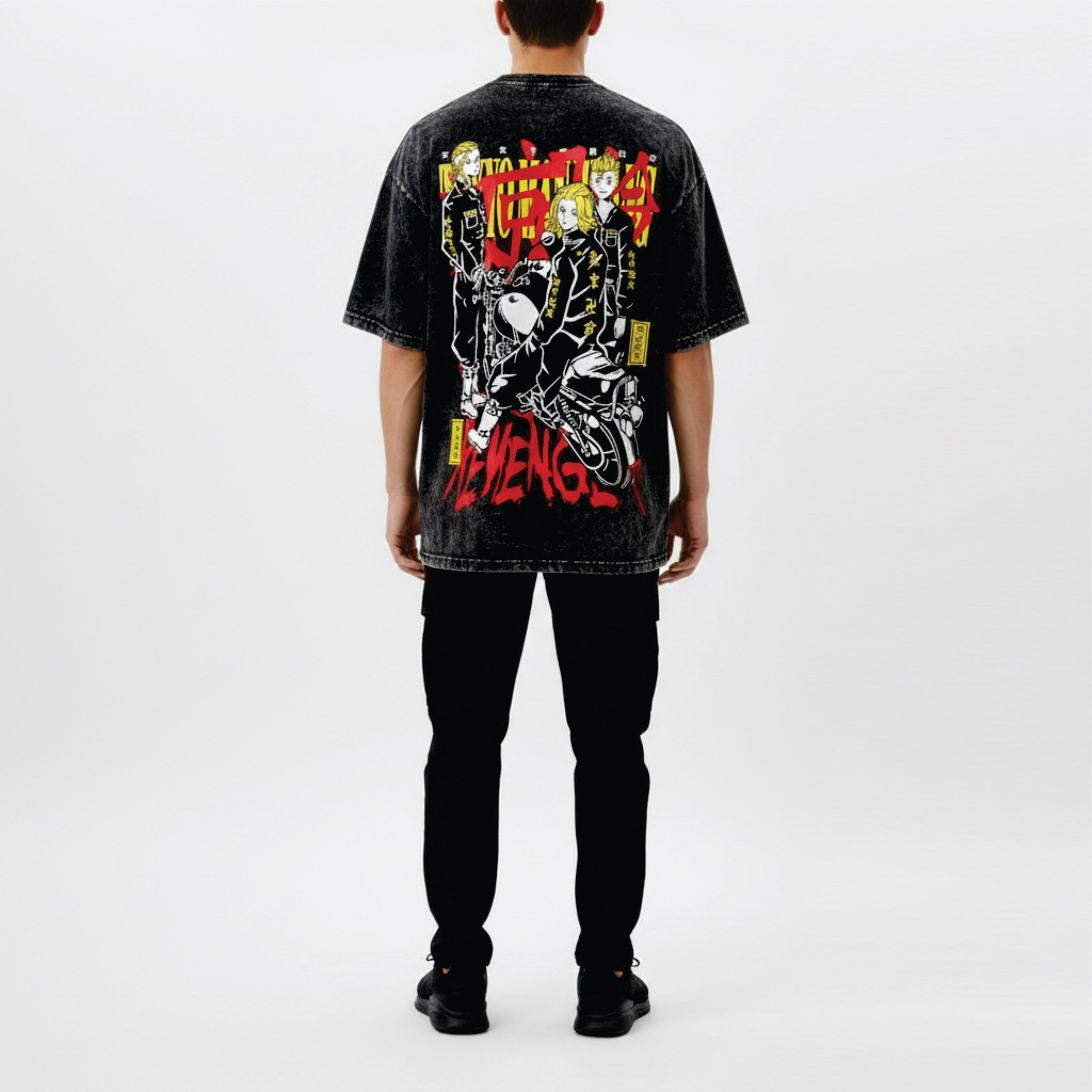 Person wearing a black t-shirt with colorful graphic design on the back, standing against a white background