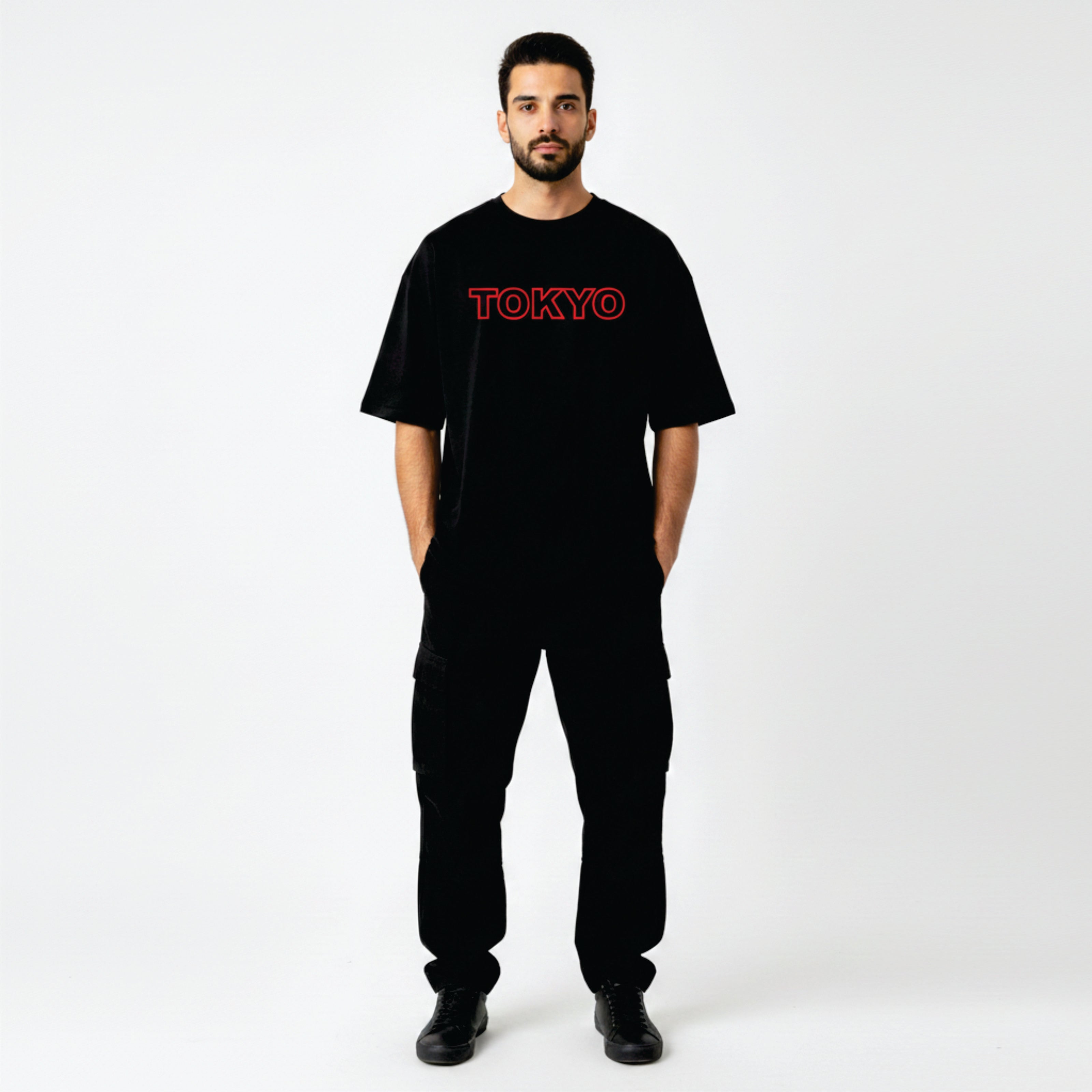 Person wearing a black t-shirt with 'TOKYO' printed in red on a white background