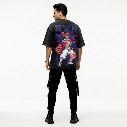 Person wearing a black t-shirt with colorful graphic design on the back, standing against a white background