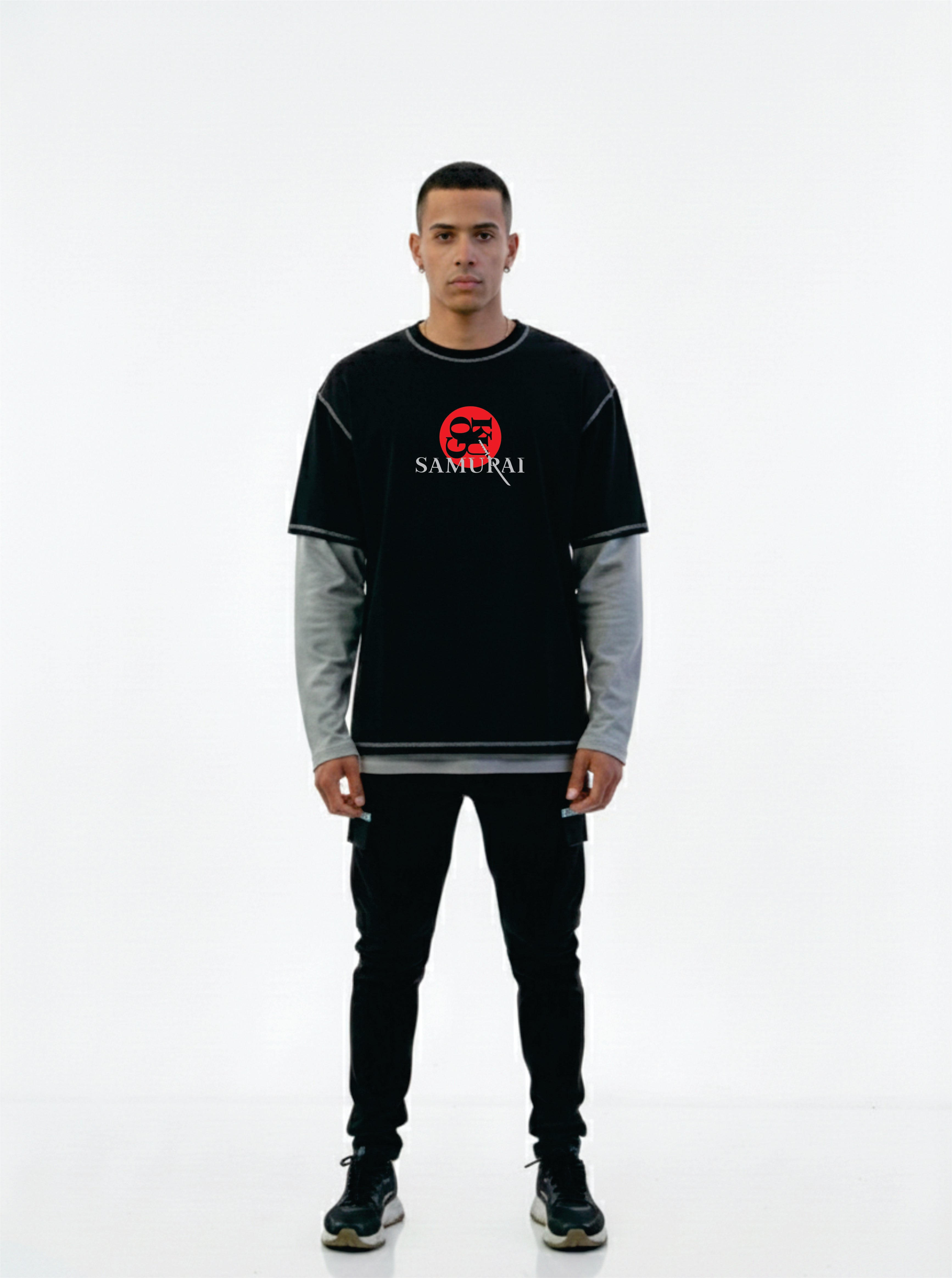 Person wearing a black and gray long-sleeve shirt with a red logo on a white background
