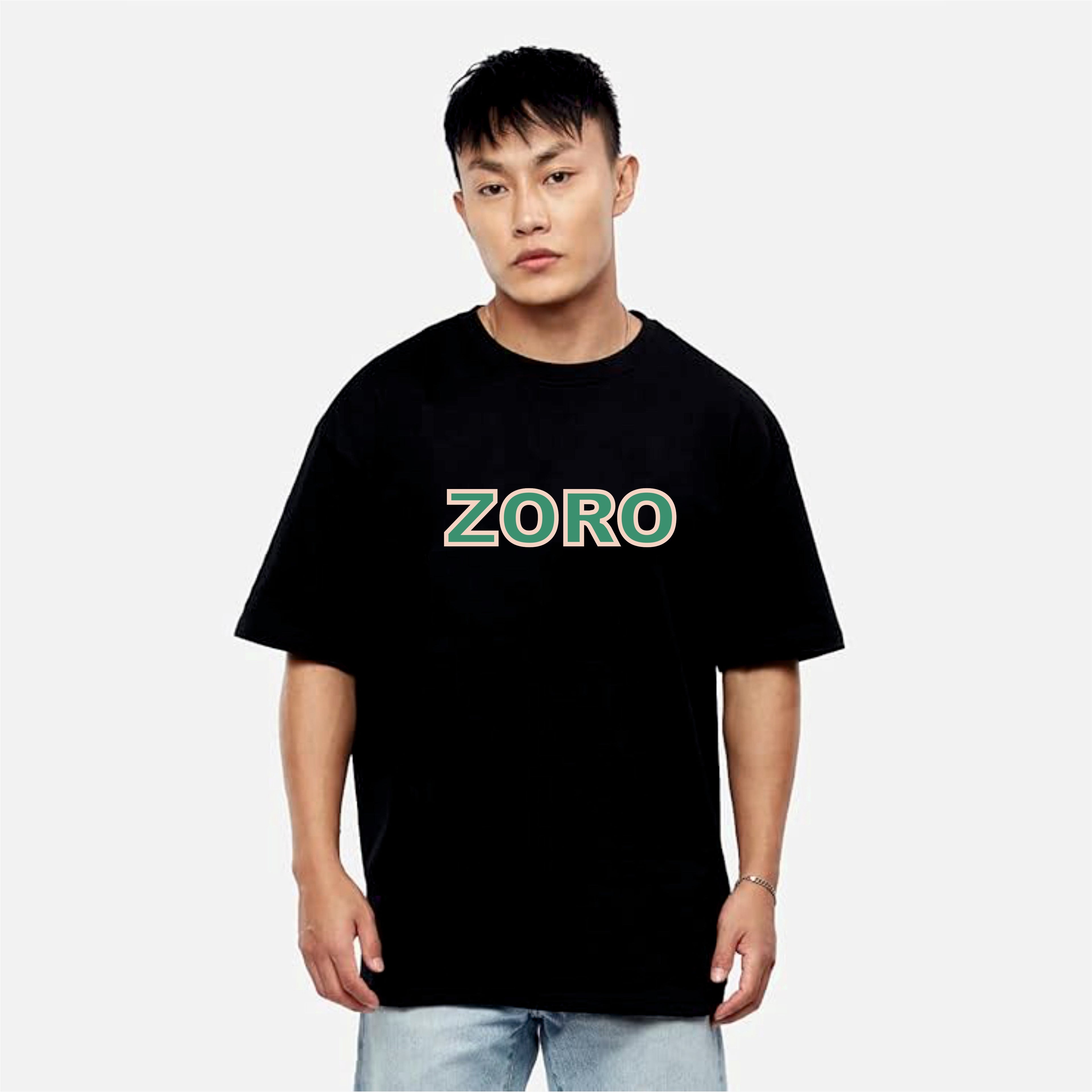 Person wearing a black t-shirt with 'ZORO' printed on it against a white background