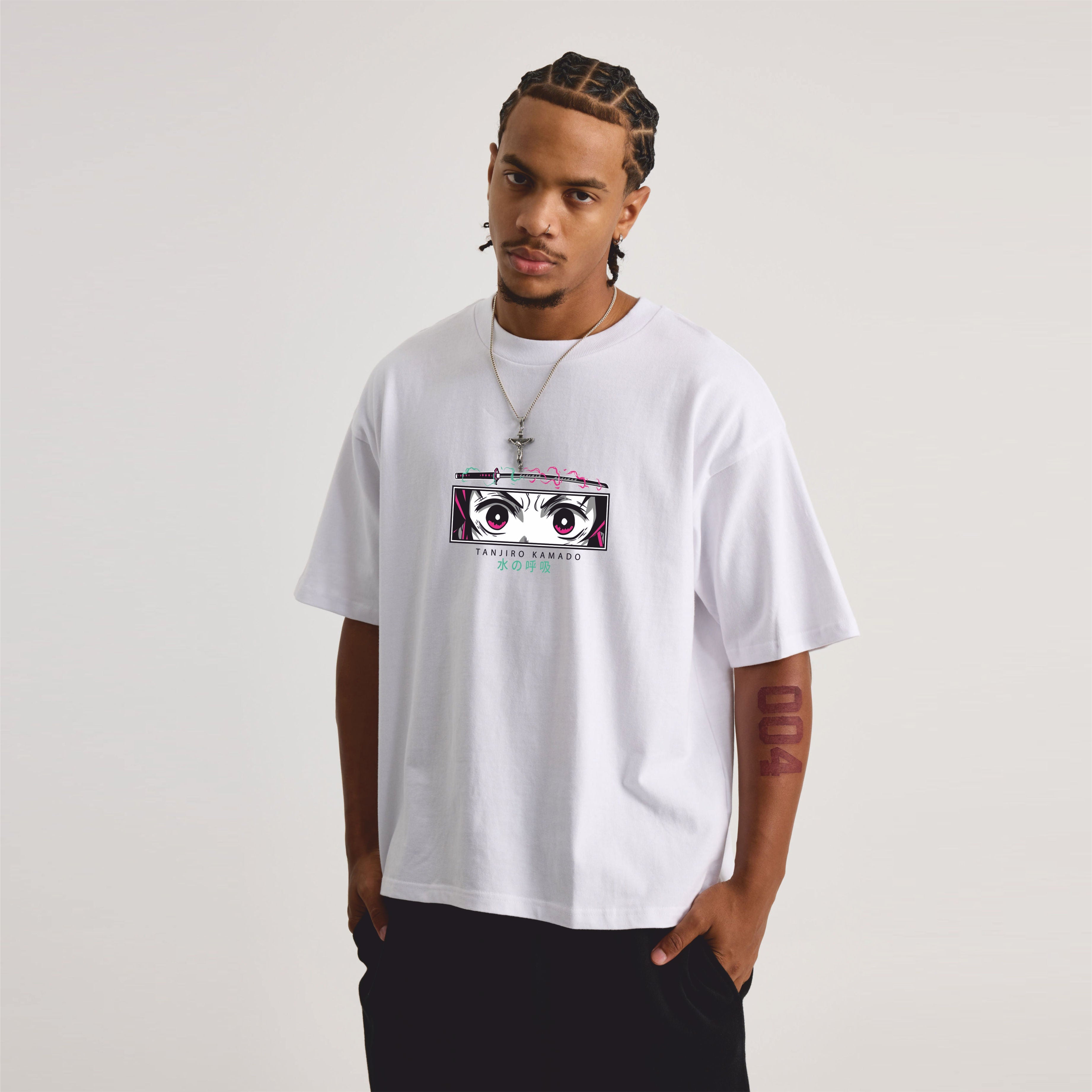 Person wearing a white t-shirt with a graphic design on a plain background