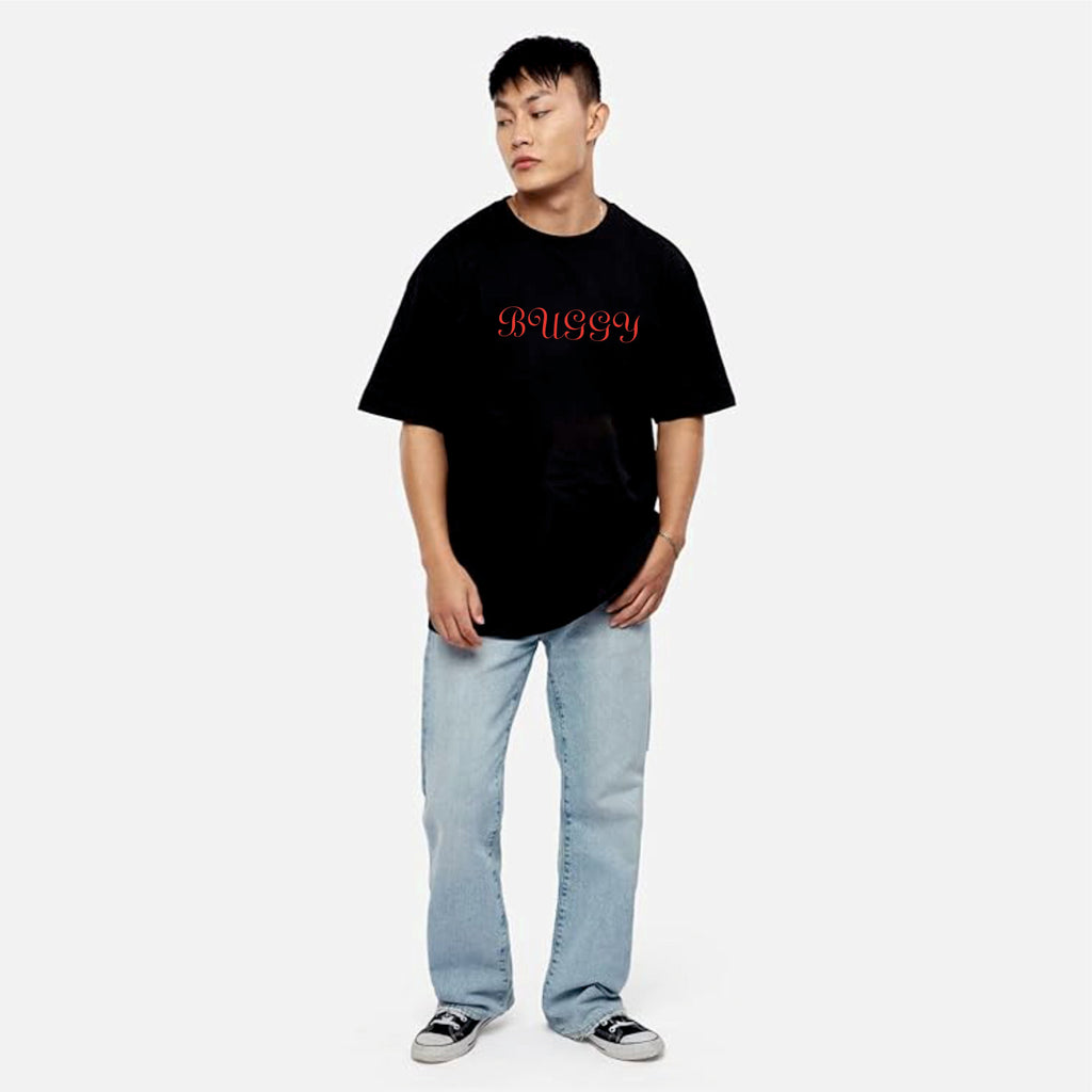 Person wearing a black t-shirt with red text